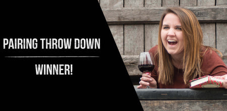 Rachel is shown on the right laughing and holding a book and glass of wine. On the left, a black background with the following white text "Pairing Throw Down Winner!"